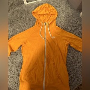 Orange Nike zip up hoodie size large.
